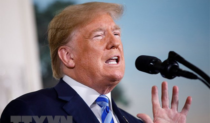 Tổng thống Mỹ Donald Trump phát biểu tại Nhà Trắng, tuyên bố quyết định rút Mỹ khỏi JCPOA, ngày 8-5. Nguồn: THX/TTXVN