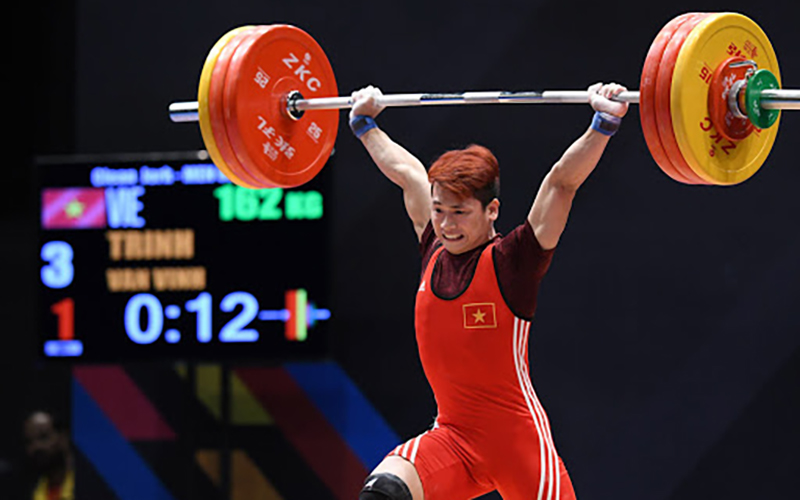 VĐV Trịnh Văn Vinh từng vô địch cử tạ thế giới hạng cân 62 kg bị cấm thi đấu bốn năm do sử dụng đô-pinh. Ảnh:TIẾN TUẤN