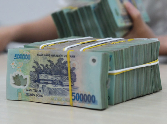 Tính đến 11-3, số thu ngân sách nhà nước đạt 574,4 ngàn tỉ đồng. Ảnh: Lê Vũ