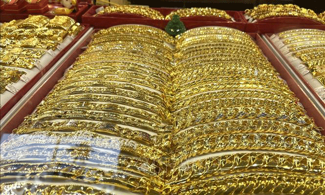 Vàng trở thành tài sản được săn đón nhất trong tuần qua do nhu cầu trú ẩn an toàn của giới đầu tư toàn cầu. Ảnh: Hứa Chung/TTXVN